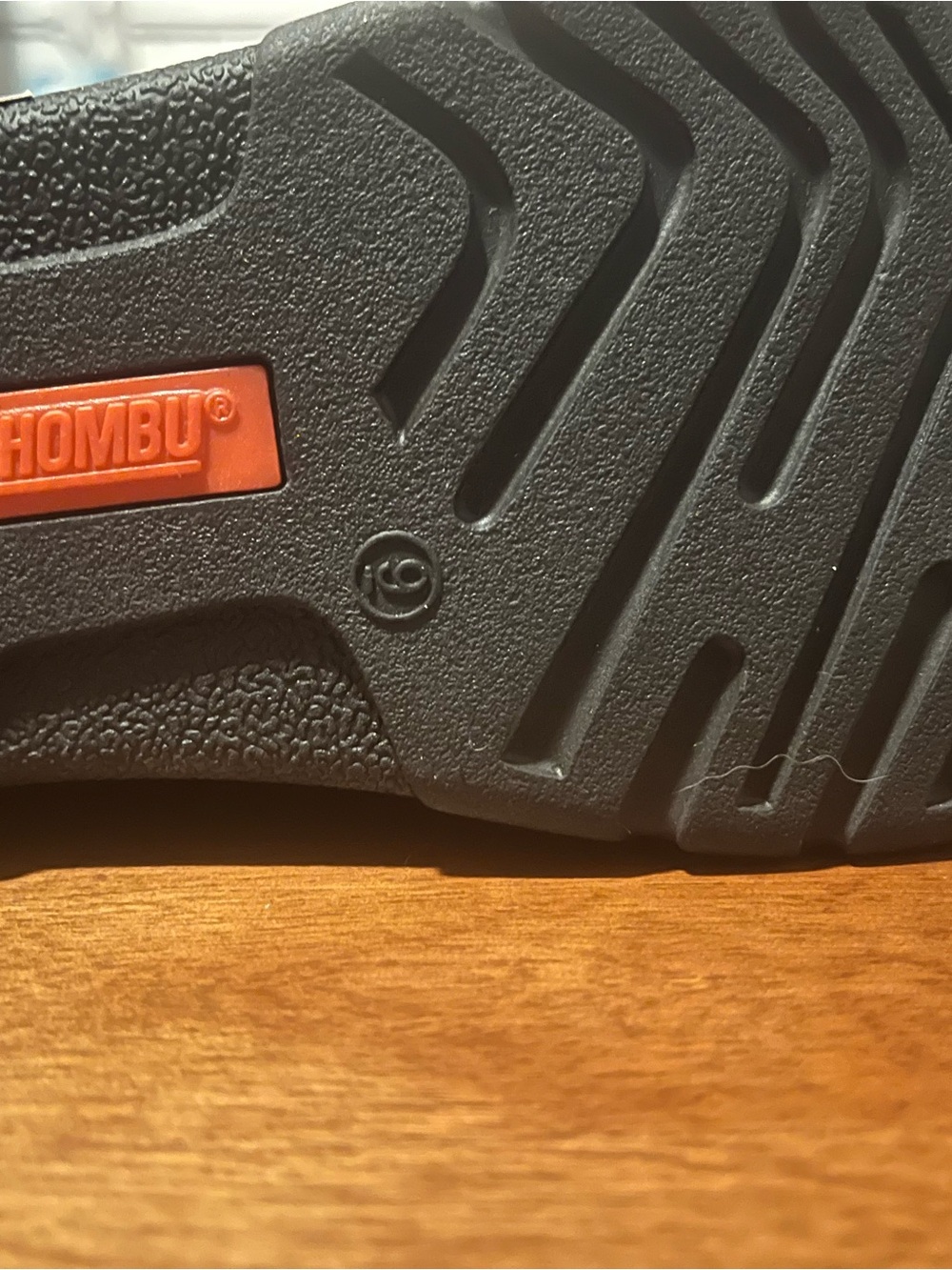 Khombu Black Slide Sandals with Orange Logo Accent